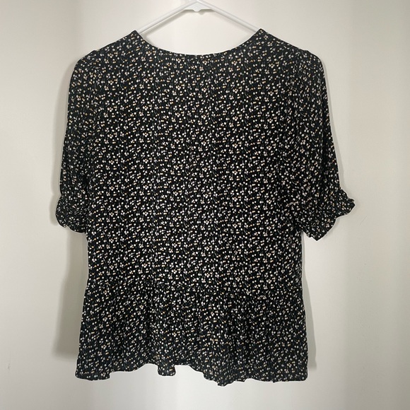 Black and floral blouse with buttons on the front. - Picture 3 of 4